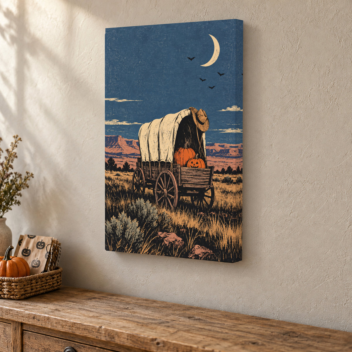 Moonlit Pumpkin Wagon canvas print above a seasonal cabinet