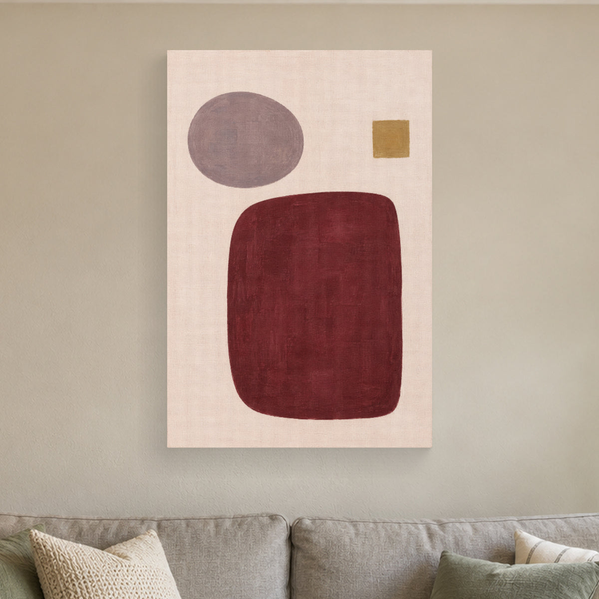 Burgundy Order canvas print above a sofa in natural window light