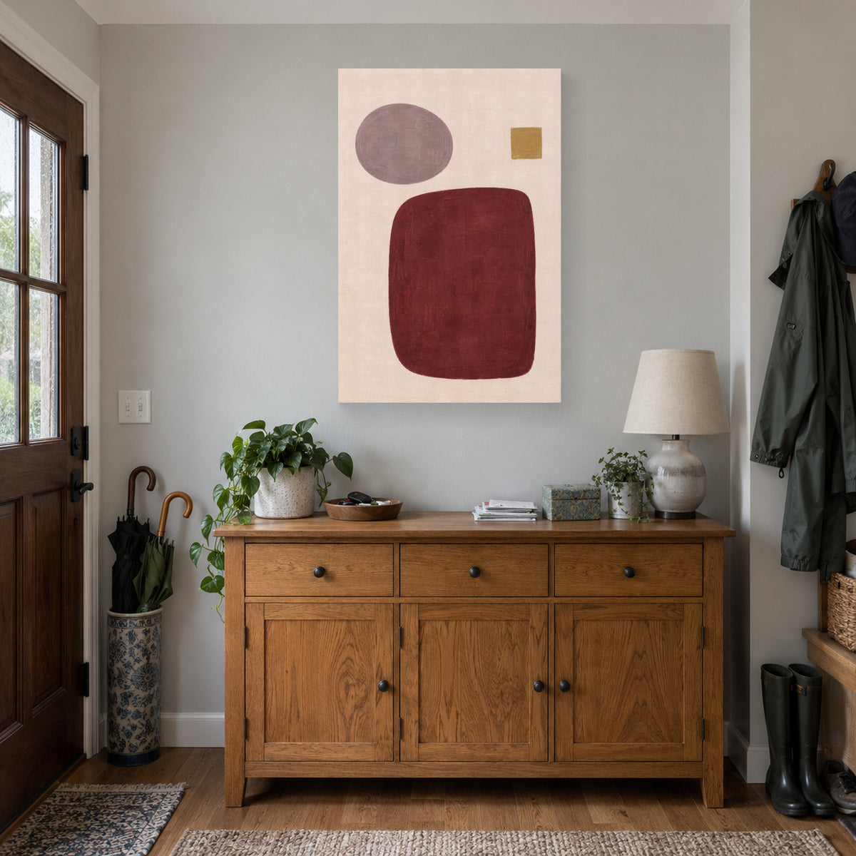 Burgundy Order canvas print above an entryway cabinet